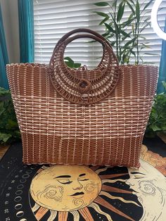 Beautiful large basket style handbag, it has a brown goldish color with white and the inside is very spacious. Bohemian Brown Straw Bag With Large Capacity, Brown Straw Shoulder Beach Bag, Bohemian Satchel Straw Bag With Large Capacity, Brown Straw Beach Shoulder Bag, Bohemian Brown Straw Shoulder Bag, Bohemian Light Brown Tote Shoulder Bag, Handheld Brown Bucket Bag For Beach, Brown Large Capacity Straw Shoulder Bag, Large Capacity Brown Straw Shoulder Bag