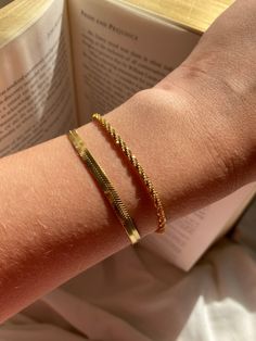 Set of two gold bracelets  Glow in gold with this bracelet stack, featuring our sparkly Rock chain, a new and unique design, made from rectangular links that are connected widthwise into a twisted row. Which creates a textured, tubular appearance with an excellent sparkle. The unique style creates a elegant, simple but statement bracelet  Stacked with our sleek and smooth herringbone bracelet, which is equally as dazzling with its reflective snake like design. Both made with plated stainless ste Unique Gold Bracelet Designs For Women, Trendy Tarnish Resistant Rectangular Bracelets, Trendy Stackable Gold Bracelet For Gift, Trendy Snake Chain Bracelets As Gifts, Trendy Snake Chain Bracelet For Gifts, Gold Trendy Stackable Chain Bracelet, Trendy Gold Stackable Chain Bracelet, Trendy Rectangular Bracelet For Everyday, Trendy Rectangular Everyday Bracelet