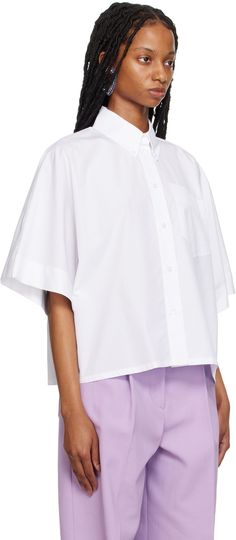 Cotton poplin shirt. · Button-down spread collar · Button closure · Patch pocket · Dropped shoulders · Crystal-cut appliqué at back collar Supplier color: White Cotton Poplin Shirt, Shirt Button, Poplin Shirt, White Shop, Cotton Poplin, Luxury Streetwear, Drop Shoulder, Patch Pocket, Designer Fashion