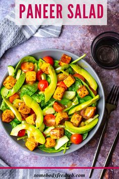 a bowl filled with chicken and veggies on top of a table