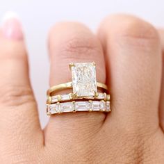 This timeless, sleek wedding band shows off five baguettes, held by heart-shaped prongs. She is pictured stacked with the Celeste ring and the Horizon wedding band, as well as the Serena ring and the Lauryn wedding band. Details: 14k white, yellow, or rose gold or platinum 1.75ct total carat weight— lab-grown diamonds or created emeralds *All diamonds are DEF color, VS1 clarity or better *Please note that colored gemstones may vary slightly in color. We do our best to accurately portray the colo Rose Gold Emerald Cut Engagement Ring, Gold Emerald Cut Engagement Ring, Emerald Cut Wedding Band, Unique Wedding Bands For Women, Sleek Wedding, Fair Wedding, Baguette Diamond Wedding Band, Baguette Wedding Band, Emerald Wedding Band