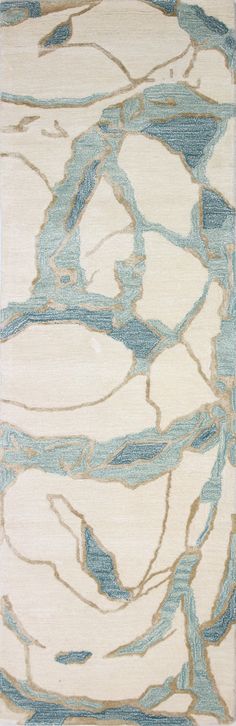 a blue and white area rug with an abstract design on the bottom half of it