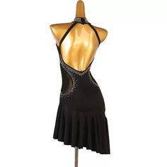 a woman's black leotard dress with sequins on the back