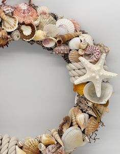 a wreath made out of seashells and starfish