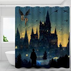 a harry potter shower curtain with hogwart's castle in the background at night