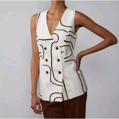 Elevate Your Wardrobe With This Stunning Brown Abstract Print Sleeveless Double-Breasted Vest From New York & Company. Perfect For Any Occasion, Whether It Be Casual, Workwear, Or Business, This Vest Is Made With High-Quality Polyester Material That Ensures Both Comfort And Durability. The Button Closure Adds A Touch Of Elegance To The Vest, While The Sleeveless Design Makes It Perfect For Layering During Any Season. This Vest Is Available In A Size L And Is Perfect For Women Who Want To Add A T Double Breasted Vest Women, Chic Spring Tank Vest, Summer Workwear Tank Vest, Trendy Sleeveless Tops For Workwear, Spring Office V-neck Tank Top, Sleeveless Tops With Buttons For Fall, Sleeveless Buttoned Tops For Work, White V-neck Vest Outerwear, Chic Beige Tank Vest