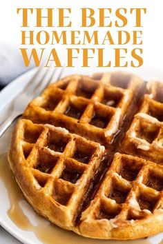 two waffles sitting on top of a white plate with syrup drizzled over them