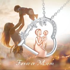 a woman holding a baby in her arms with the words forever mom written on it