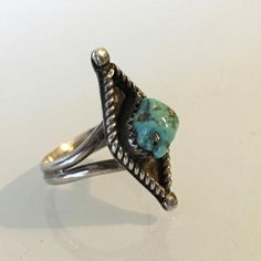 Beautiful sterling silver and turquoise ring with the hallmark of noted Navajo jewelry maker Melvin Thompson (MT). It has a diamond she with a rope rim and a lovely light blue turquoise nugget secured in the center. Size is and in it is in very nice condition overall.Be sure to favorite and visit Jigsandlarry again as I'm always adding new items, from mid century modern ceramics and art glass to rare and unusual books. Reasonable offers will be considered.Please note that everything I have liste Mid Century Modern Ceramics, Navajo Jewelry, American Southwest, Southwestern Jewelry, Modern Ceramics, Weird And Wonderful, Jewelry Maker, Blue Turquoise, Art Glass