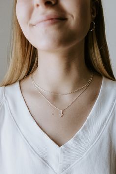 Elevate your everyday look with this sterling silver necklace featuring a dainty satellite chain + opal pendant. Classic and elegant, perfect for any occasion. ∙ D E T A I L S∙ - 925 Sterling Silver - Cross Pendant - 0.9mm Box Chain - Your choice of 16, 18, or 20 inches ∙ STERLING ∙ SILVER ∙ Sterling silver is a metal alloy created by combining 92.5% pure silver with 7.5% other metals, typically copper. While Sterling Silver may darken due to oxygen exposure it can easily be polished without damaging the metal itself. You should even be able to pass your silver jewellery on to future generations! Silver Charm Necklaces With Satellite Chain, Silver Dainty Charm Necklace For Layering, Silver Minimalist Charm Necklace For Layering, Minimalist White Charm Necklaces For Layering, Minimalist Silver Charm Necklace With Satellite Chain, Dainty White Charm Necklace With Cable Chain, Delicate Sterling Silver Jewelry With Paperclip Chain, Delicate Sterling Silver Paperclip Chain Necklace, White Sterling Silver Necklace With Satellite Chain