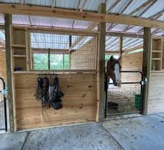 the inside of a stable with horses in it