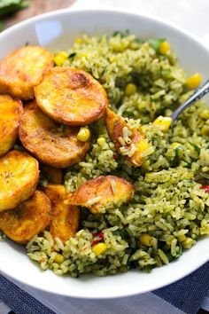 a white bowl filled with rice and fried plantains next to a spoon in it