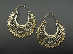 Premium gold/silver plated brass earrings with unique and intriguing design patterns. RETURNS: Our major goal is to present all products as promised with accurate item descriptions along with pictures. But there are times when you may need to return occasionally. Returns are happily accepted but then we kindly request you to complete all your return within 30 days of receiving your item/s. **All the item/s must be returned unused and without any damage in the same condition you received it, with Metal Hoop Earrings With Intricate Dangle Design, Small Hoop Metal Earrings For Festivals, Festival Dangle Metal Hoop Earrings, Brass Filigree Dangle Hoop Earrings, Brass Filigree Hoop Earrings, Festival Metal Dangle Hoop Earrings, Festive Dangle Metal Hoop Earrings, Ornate Gold Brass Hoop Earrings, Brass Filigree Hoop Earrings For Festivals