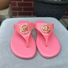 New With Tag Tea Rose Pink Color Spring Pink Flip Flops With Cushioned Footbed, Pink Cushioned Flip Flops For Spring, Spring Pink Cushioned Flip Flops, Pink Synthetic Jelly Sandals With Cushioned Footbed, Pink Synthetic Toe Post Sandals, Pink Flat Summer Flip Flops, Pink Flat Synthetic Flip Flops, Spring Michael Kors Synthetic Sandals, Michael Kors Trendy Beach Sandals