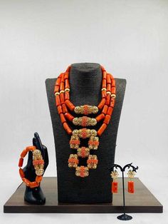 Handcrafted African Coral Beads Necklace - Unique Ethnic Jewelry for a Statement Look Materials: 1. Natural/Original African Coral bead 2. Gold color accessories  3. This listing contains 3 layers of necklace, 2 bracelets and a set of dangling earrings. Colour of Accessories: Gold  Items are 3 layers of necklace, 2 bracelets, a pair of earrings and  Description: 🌍 African Elegance: Immerse yourself in the rich cultural tapestry of Africa with this exquisite necklace. Each vibrant coral bead tel Handmade Gold Beaded Necklaces For Traditional Ceremonies, Elegant Beaded Necklaces For Traditional Ceremonies, Gold Beaded Necklaces For Traditional Ceremonies, Traditional Gold Bead Necklaces For Ceremonies, Traditional Gold Beaded Necklaces For Ceremonies, Ceremonial Festival Jewelry With Colorful Beads, Traditional Orange Jewelry For Ceremonies, Colorful Round Beads Jewelry For Traditional Ceremonies, Red Large Beads Jewelry For Traditional Ceremonies