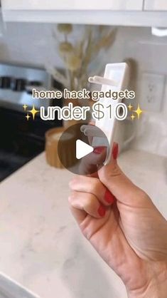 a woman holding up a cell phone in her hand with the text home hack gadgets under $ 10