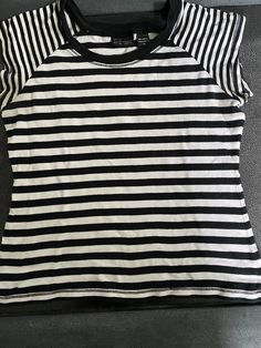 Vintage striped cap sleeve Women's t-shirt.  Black and white bold striped fabric with  cap sleeves.  Brand is New York and Company. 80's 90's style Size Women's Medium.   Measurements with garment laying flat: Chest 18" Shoulder to Hem 21" **Small yellow spot on front of shirt - see last photo.  I did not try to remove this stain.** Very good, vintage, used condition!  Please message me with any questions. Cheap 90s Style Striped Tops, Retro Striped Streetwear Tops, Retro Striped Tops For Streetwear, Retro Striped T-shirt For Streetwear, Casual Tops With Striped Short Sleeves, Fitted Striped Tops For Streetwear, Casual Short Sleeve Tops With Striped Sleeves, Spring Striped T-shirt With Three Stripes, Striped T-shirt With Three Stripes For Spring