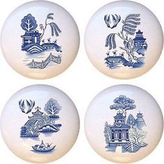 four blue and white plates with designs on them