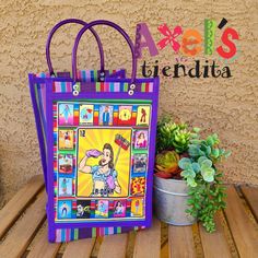 "This bright and fun mercado bag is so pretty and fun! The colors will make you smile, I promise! My mom takes her mercado bags when she goes to the mercado every Sunday when she goes to the farmers market in Mexico. These bags also remind me of my abuelitas holding theirs everywhere they went. They bring me back home and I love people here in the US love them too :) The bag is made out of plastic mesh. It measures approximately: 12\" tall 7 3/4\" wide 7\" deep Handles are about 4\" tall 100% wa Purple Square Shopping Bag, Multicolor Rectangular Bags For Errands, Multicolor Rectangular Bag For Errands, Purple Square Box Bag For Shopping, Purple Shoulder Box Bag For Shopping, Multicolor Pouch Box Bag For Shopping, Multicolor Rectangular Canvas Bag For Errands, Purple Tote Box Bag For Daily Use, Multicolor Tote Lunch Bag For School