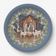 a blue plate with a nativity scene painted on it