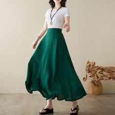 "This green skirt designed with right hidden zipper, elastic band on back for sure and comfortable fit. This skirt can be a basic piece in your wardrobe. Due to its classic cut and rich solid color it can be easily matches with many different styles. You'll feel ultra chic and modern wearing the A Line skirt throughout the year. DETAIL * 100% Linen * Two side deep pockets * Right Hidden Zipper closure * Back elastic waistband * A-line skirt * Maxi linen skirt, Plus size Skirt * Ankle length effect * Perfect for Summer and spring and autumn * Machine Washable in Warm/Cold Water/Do not bleach /Mid-iron /Hang Dry *The model is 170 cm (5′7″) tall with a 80 cm (31.5\") bust, 66 cm (26\") waist. She is wearing the green skirt in size XS. CUSTOM MADE SERVICE If you * Change other color * Can't fi Green Non-stretch Pleated Maxi Skirt, Non-stretch Green Skirt, Green Non-stretch Skirt With Elastic Waistband, Green A-line Bottoms For Spring, Green A-line Spring Bottoms, Green Flared Skirt With Elastic Waistband, Casual Green Skirt, Green Full Lined Maxi Skirt, Green Wide-leg Lined Maxi Skirt