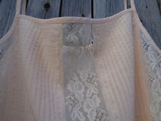 "This is a beautiful spaghetti strap top made of polyester fabric in pale peach color. Complemented with Nylon lace. Brand: St Michael made in the U.K. In excellent condition and comes from smoke-free home. Size M Labelled as size UK 14 (Eur 40; US 10) To fit bust ~36\" / 91cm Thanks for visiting my shop! OLaLaVintage Please visit my other Etsy shop of beautiful handmade items: https://www.etsy.com/shop/MilaStyle" Summer Camisole With Lace Bodice, Cream Camisole With Adjustable Spaghetti Straps, Spring Lace Bodice Camisole With Spaghetti Straps, Summer Lace Bodice Camisole, Cream Camisole With Built-in Bra And Spaghetti Straps, Feminine Beige Camisole With Spaghetti Straps, Feminine Beige Spaghetti Strap Camisole, Spring Beige Camisole With Delicate Straps, Cream Lace Camisole With Spaghetti Straps