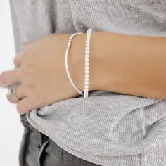 "These Simply yet elegant silver minimal ball bracelet set is prefect for everyday wear. These stunning silver bar bracelet is around 7\" in length. Includes a Bar Bracelet with 3mm beads and a sterling silver bracelet with all 4mm beads. This is the prefect everyday piece to add to any collection. Great wear alone or layered together. Prefect gift for bridesmaids or any special occasion. Price includes two sterling silver bracelets. All Jewelry is personalized and packaged in our small studio ? Beaded Chain Bracelet, Silver Bar Bracelet, Silver Beaded Bracelet, Gift For Bridesmaids, Everyday Gifts, Bracelet Dainty, Dainty Bracelet, Silver Bead Bracelet, Ball Bracelet