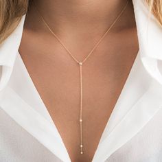 Our Selena lariat necklace is the perfect accessory! You can choose between 2 necklace lengths: 16" and 18" inch. This necklace is made of solid 14k gold and has 4 diamonds with the center diamond being .07 carats and the drop diamonds being .06 carats. We offer this piece in Yellow and white Gold. Layer this beautiful and delicate diamond lariat necklace or show it off on its own. ✨ Features ✨ • Ready To Ship. • Made in the USA.• Gold : Solid 14K• Choice of Gold: Yellow Gold, White Gold• Gem St Diamond Lariat Necklace, Lariat Style Necklace, Gold Lariat Necklace, Jewel Wedding, Diamond Jewelry Designs, Solid Gold Jewelry, Lariat Necklace, Rose Gold Necklace, Drop Necklace