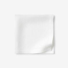 a white napkin folded on top of a table