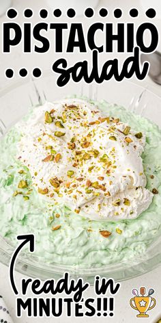 pistachio salad with whipped cream and pistachio seeds on top in a glass bowl