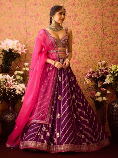 Step into refined elegance with the phlox purple hand-embroidered silk brocade blouse paired with a multi-panel brocade lehenga. This exquisite ensemble showcases intricate embroidery on the blouse, beautifully complemented by a flowing lehenga that adds depth and movement. An embroidered belt cinches the waist, while the matching dupatta completes the look, making it an ideal choice for festive celebrations and special occasions. Brocade Embroidery, Contrast Dupatta, Cancan Lehenga, Brocade Lehenga, Brocade Pattern, Brocade Blouse, Padded Blouse, Brocade Blouses, Embroidered Belt