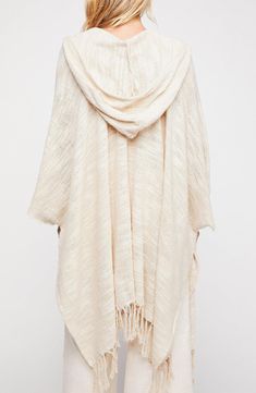 The only thing better than a Saachi ruana? A Saachi ruana with a hood! Our Dawn to Dusk Hooded Ruana Wrap is soft and cozy and will take you through all seasons. 27" length; 6.5" fringe (one size) Open front Kimono sleeves Knitted construction 100% cotton Hand wash cold, line dry Imported Hooded Kimono, Color Palette Warm, Siren Aesthetic, Free People Kimono, Ruana Wrap, Pool Essentials, Fringe Kimono, Kimono Sweater, Fringed Poncho