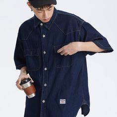 Elevate your wardrobe with our Japanese Label Denim Shirt. Made from the finest denim, this shirt exudes sophistication and luxury. Its Japanese label adds a touch of exclusivity to your look. Elevate your style and feel confident in this premium shirt. Features: -66%Polyester 34%Cotton -Stand Collar -Full zip closure -Letter Graphic -Regular fit -High Street Style