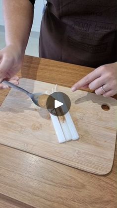 a person cutting up something with a knife