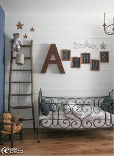 a child's bedroom with a metal bed and ladder