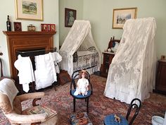 there is a baby sitting on a chair in the middle of a room with other furniture