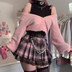 Transform your style vocabulary with our Pastel Goth Pleated Mini Skirt. Drenched in a pastel goth aesthetic, this plaid wonder comes with intricate ribbon and lace details, setting you apart from the crowd. The zip side fastening and lace-up detail offer comfort, fit and a unique edge. Unleash your inner fashionista at gatherings or leisurely hangouts. Add black fishnet stockings and a crop top, and let your outfit narrate your style story. Pastel goth aesthetic Plaid Ribbon & lace details Zip Girly Emo, 00s Mode, Emo Fits, Mode Emo, Mode Kawaii, Pastel Goth Fashion, Kawaii Fashion Outfits, Mode Kpop, Goth Aesthetic