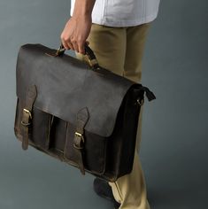 "This bag is all you need to carry your everyday stuff to office or college, At MaheTri we stand by our products and hope that you enjoy our products as much as we enjoy making them. This Briefcase is made from the finest Full Grain Hunter buffalo leather and lined with a high-quality fabric this bag is handcrafted by artisans working with leather for decades Salient Features Full-grain buffalo leather: Made from the finest 100 % Genuine Hunter buffalo leather and lined with a high-quality fabri School Shoulder Bag Briefcase With Laptop Sleeve, School Briefcase With Laptop Sleeve And Shoulder Bag Shape, School Briefcase With Laptop Sleeve And Shoulder Strap, Professional Everyday Rectangular Bag, Professional Satchel Bags For Daily Use, Professional Rectangular Shoulder Bag For Everyday Use, School Tote Briefcase With Laptop Sleeve, School Briefcase With Laptop Sleeve In Tote Style, School Satchel Briefcase With Laptop Sleeve