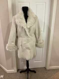 This nice vintage 90s Mixit Bone cream Almost Famous Faux Fur Penny Lane 90s Faux fur boho festival jacket comes to you in a size M. As you can see from the pictures of jacket no issues very nice. On the back there is a small mark. Very nice cool cond. Cream Long-sleeved Fur Coat For Winter, Cream Fur Coat With Faux Fur Lining, Cream Long Sleeve Fur Coat For Winter, Cream Faux Fur Coat With Faux Fur Lining, Cream Long Coat With Faux Fur Trim, Beige Faux Fur Coat For Cold Weather, Cream Faux Fur Outerwear With Trim, Cream Faux Fur Trim Outerwear, Cream Faux Fur Outerwear With Fur Trim