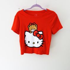 Hello Kitty Red Graphic Print Crop Top This Is A Junior's Large. It Fits Women's Medium As Well. New No Tag On. Color: Red/ White Super Cute Top For The Season. Round Neck Short Sleeve 100% Cotton Welcome To Bundle, Fast Shipping! Red Cotton Hello Kitty T-shirt, Red Hello Kitty Print Crew Neck Top, Red Hello Kitty Short Sleeve Tops, Red Crew Neck Top With Hello Kitty Print, Casual Red Hello Kitty Top, Red Hello Kitty Cotton T-shirt, Casual Red T-shirt With Hello Kitty Print, Red Cotton T-shirt With Hello Kitty Print, Cute Red Fitted T-shirt