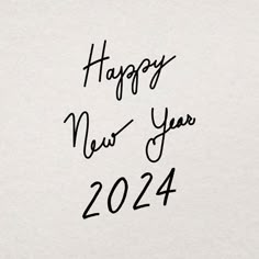 happy new year 2012 written in black ink on a white paper with the words'happy new year 2012 '