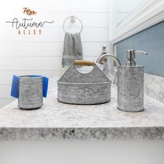 a bathroom counter with two soap dispensers on it