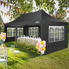 an outdoor event tent with tables and chairs