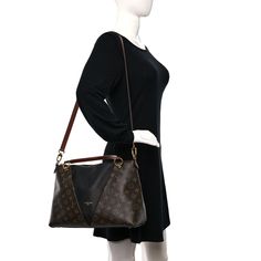 This is an authentic LOUIS VUITTON Monogram V Tote MM in Black. This chic handbag is crafted of Louis Vuitton monogram on coated canvas with black leather trim. The bag features a hidden zippered pocket on the front, polished gold hardware, rolled leather handles, and an optional adjustable leather shoulder strap. The top zipper opens to a black microfiber interior with patch pockets. Chic Handbags, Leather Handles, Authentic Louis Vuitton, Leather Handle, Leather Trims, Gold Hardware, Louis Vuitton Monogram, Patch Pocket, Shoulder Strap