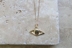 Be one step ahead of the unexpected with our artistic Gold Evil Eye Necklace bringing karma and luck. Cast in recycled 14k yellow gold and made to order, carved by hand in wax by Jessica Hung from a handmade 18" 14k gold chain. Weighs approx. 3.4 grams We will be donating a portion of sales of this necklace the the Palestinian Children's Relief Fund which provides urgent humanitarian and medical aid to children in Gaza and occupied Palestine. This evil eye necklace can be purchased alone as a ch Spiritual Gold Eye-shaped Necklace, Yellow Gold Evil Eye Medallion Jewelry, 14k Gold Evil Eye Amulet Necklace, Yellow Gold Medallion Jewelry With Evil Eye, Yellow Gold Jewelry With Evil Eye Medallion, Gold Spiritual Jewelry With Evil Eye, Gold Evil Eye Amulet Jewelry, 14k Gold Evil Eye Amulet Jewelry, Gold Spiritual Necklace With Diamond Eyes