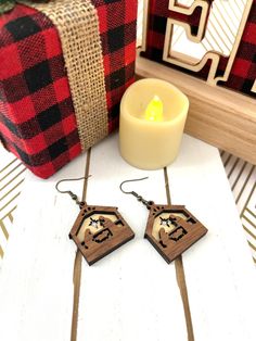 These Christmas Nativity earrings are laser cut and etched from 3mm walnut wood which was sealed with clear polyurethane. The scene depicts the Virgin Mary and St. Joseph praying to the baby Jesus. These are Classy decorative and festive earrings for the Christmas season. Check out some of my other listings to see more Christian Jewelry For Women The earrings are set on an antique brass dangle earring hook nickel-free and hypoallergenic. These are very lightweight, unique, and not overly bulky. Each pair comes packaged and ready for gifting. Please do not wear them in the shower or while swimming. We don't accept exchanges/returns on our earrings for sanitary reasons. If you have an issue with your order just contact me and we can work it out. Nativity Earrings, Christian Jewelry For Women, Festive Earrings, Saint Joseph, Gravure Laser, Women Christmas, Christmas Nativity, Christian Jewelry, Small Earrings