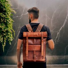 Handmade Genuine Leather Backpack Laptop Bag Brown Leather Backpack Hiking Bag fits Laptop upto 15.6" for Men or Women Backpack Highlights: Size : 23 x 14 x 5 inches (58 cm x 35 cm x 12 cm) Color : Brown Additional Information: -Spacious main compartment -Large front pocket & Brass polished hardware -Top Carry Handle & Concealed Push Lock Closure -Polyester inner lining with Pen holder -Zippered pocket inside with Phone holder -Wide, Adjustable & Soft Padded shoulder straps Handcrafted from Genuine Top grain Leather with a nostalgic scent from traditional tanning. Handmade and uniquely varied in look making it perfect for college, business, travel, short hiking, camping and outdoor activities. Designed with an innovative suspension system, it protects your back from discomfort while provid Leather Backpack As Gift, Rectangular Leather Backpack For Adventure, Rectangular Backpack With Leather Backing For Adventure, Rectangular Backpack With Waxed Finish For Daily Use, Rectangular Waxed Backpack For Daily Use, Rectangular Waxed Finish Backpack For Daily Use, Rectangular Adventure Backpack With Leather Backing, Brown Rectangular Leather Backpack For Adventure, Luxury Brown Leather Backpack For Men