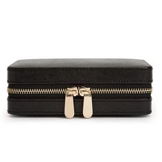 The perfect way to travel with your jewelry. This chic travel jewelry case made by Wolf is the perfect way to safely store your jewelry. This high quality case Includes anti-tarnish lining and gold finish. The dimensions of this case are 6.75" L X 4.5" W X 2.5" H. There are several sections in the case including four ring rolls, three storage compartments, a mirror and a spot for your earrings and necklaces. This style is available in black or rose gold and is perfect for keeping all of your jew Timeless Rectangular Travel Case, Elegant Black Jewelry With Gold-tone Hardware, Classic Rectangular Case, Elegant Compact Case With Included Case, Elegant Compact Case, Elegant Portable Cases For Business, Elegant Round Business Case, Travel Jewelry Storage Rectangular Case, Black Luxury Portable Cases