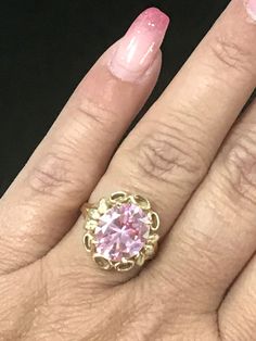 GORGEOUS VINTAGE 14K YELLOW GOLD LARGE PINK STONE RING Very pretty ring crafted of solid 14K Yellow Gold! Band a little bent but does not affect wear. Large pink stone solitaire, 13mm x 11mm Weighs 5.4 grams total. Size 6.25 Shipped with insurance. Classic Pink Gold Rings With Center Stone, Pink 14k Gold Jewelry With Center Stone, 14k Pink Gold Rings Fine Jewelry, Pink Formal Birthstone Ring, Formal Pink Birthstone Ring, Pink Round Heirloom Jewelry, Vintage 14k Gold Pink Rings, Pink Gold Ring With Center Stone In Round Cut, Pink Gold Ring With Center Stone, Round Cut