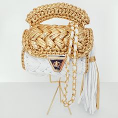 Handmade Shoulder and Crossbody Bag with Luxury Metallic Yarn The bag is completely handmade. It is custom made for you in the color of your choice.  It is the most fashionable bag of 2022 with its golden color chain, ring, clasp and lock accessories.  It is a nice bag that you can use both in sports style and daily with its tassel and handle details.  Optionally, you can easily remove the chain and tassel details and use them according to your style.  It will complement your elegance with daily and evening dresses. Suitable for any style.  A universal accessory for a fashionable and an original look. Unique and original. It can store cosmetics, keys, books, phones, etc. items can fit comfortably. It can be a great gift for you, your loved ones, friends, girlfriend and mom. It will also be White Crochet Crossbody Bag With Braided Handles, Handmade Gold Top Handle Shoulder Bag, Handmade White Pouch Shoulder Bag, Handmade White Bucket Shoulder Bag, White Handmade Straw Shoulder Bag, White Handwoven Crossbody Shoulder Bag, Handmade White Straw Shoulder Bag, Handmade Gold Satchel Bag, White Hand Knitted Tote Bag